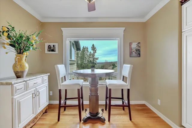 a kitchen with granite countertop stainless steel appliances sink stove microwave and cabinets