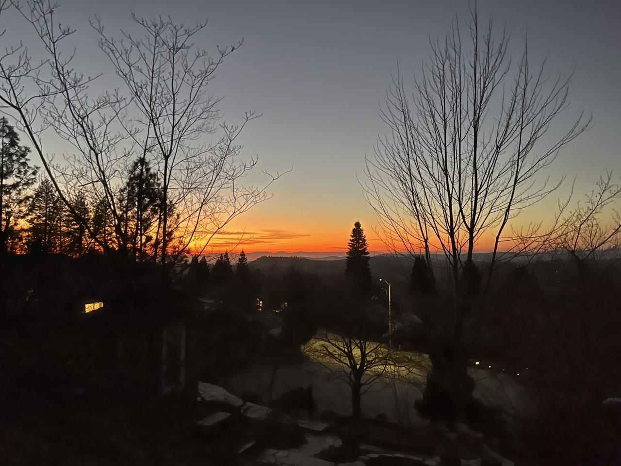 124 Ruby Ledge Court Grass Valley, CA 95945 - Photo 2 of 87 a backyard of a house with table and chairs