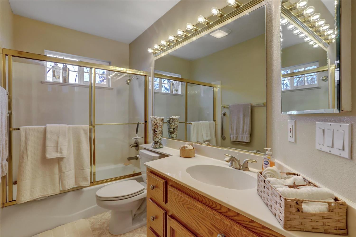 124 Ruby Ledge Court Grass Valley, CA 95945 - Photo 24 of 87 a bathroom with a sink toilet and shower