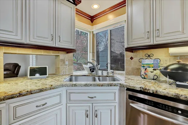 a bathroom with a sink mirror vanity and toilet