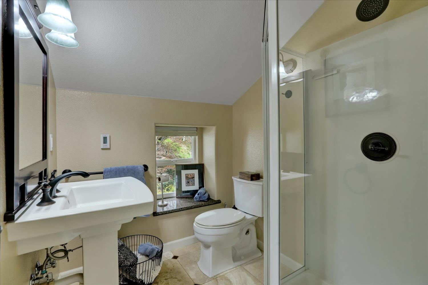 124 Ruby Ledge Court Grass Valley, CA 95945 - Photo 36 of 87 a bathroom with a sink mirror vanity and toilet