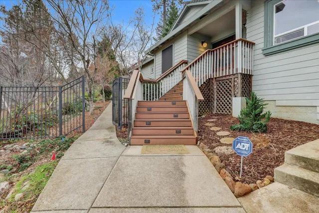 a view of a dining room with furniture and a window