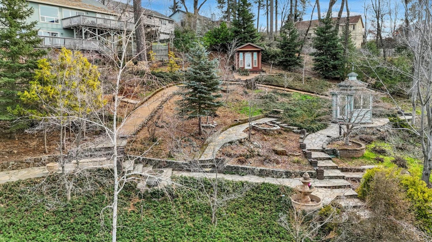 124 Ruby Ledge Court Grass Valley, CA 95945 - Photo 5 of 87 a view of a yard with plants and large trees