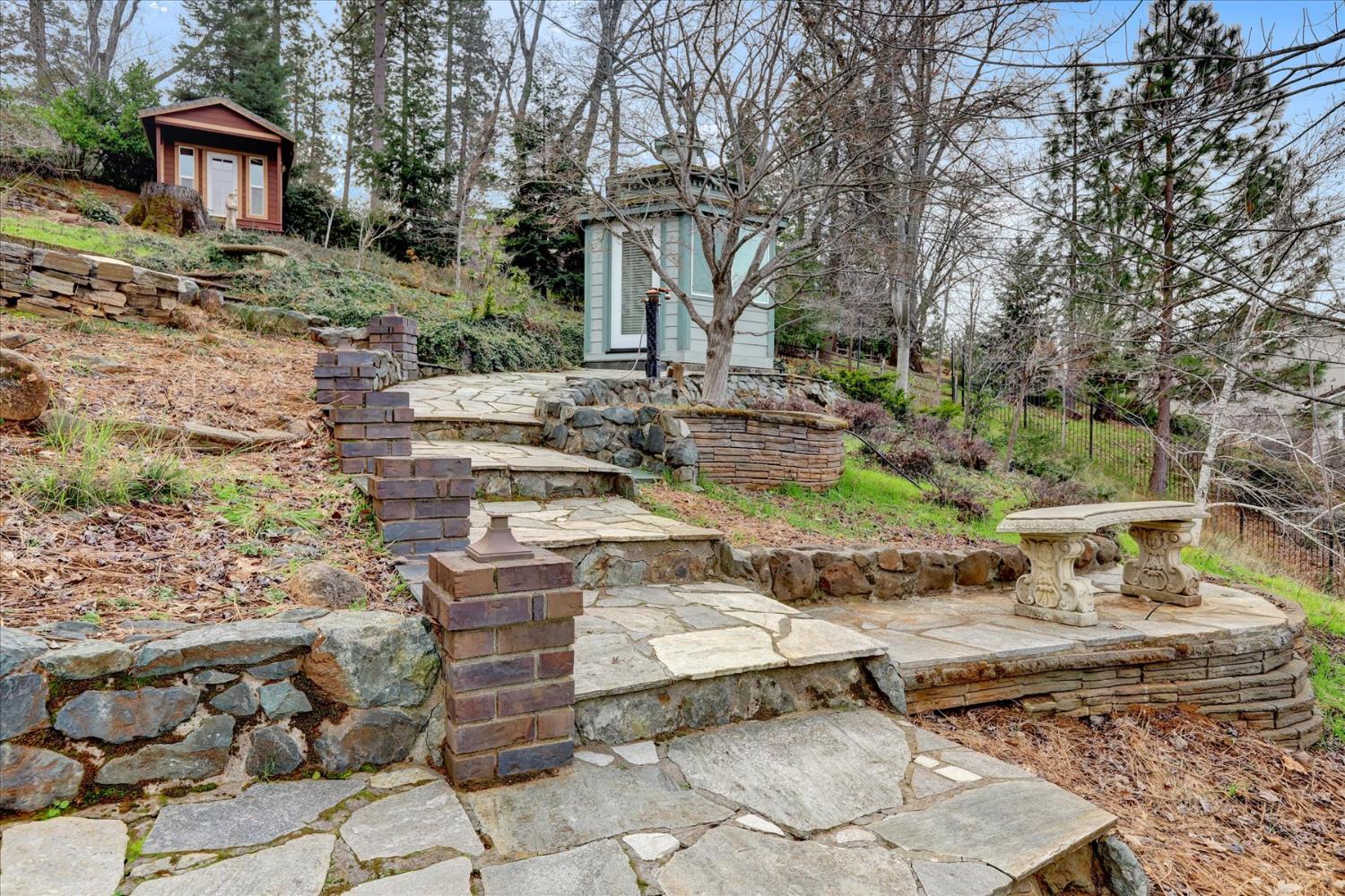 124 Ruby Ledge Court Grass Valley, CA 95945 - Photo 69 of 87 a view of a house with backyard and sitting area