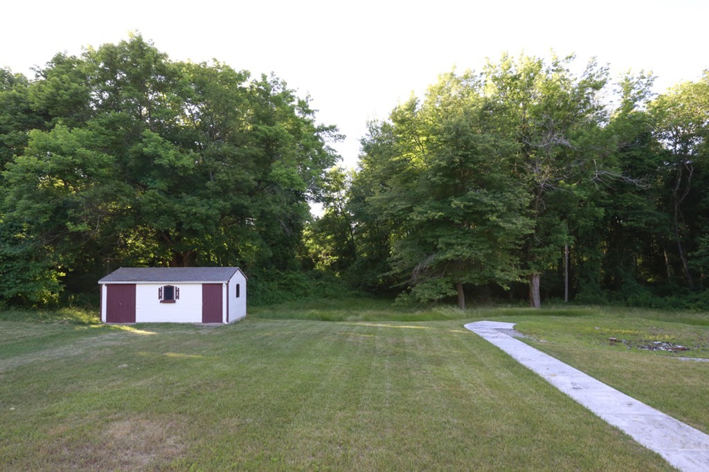 485 Rhodes Avenue Woonsocket, RI 02895 - Photo 16 of 18 a view of a trees with a lush green field