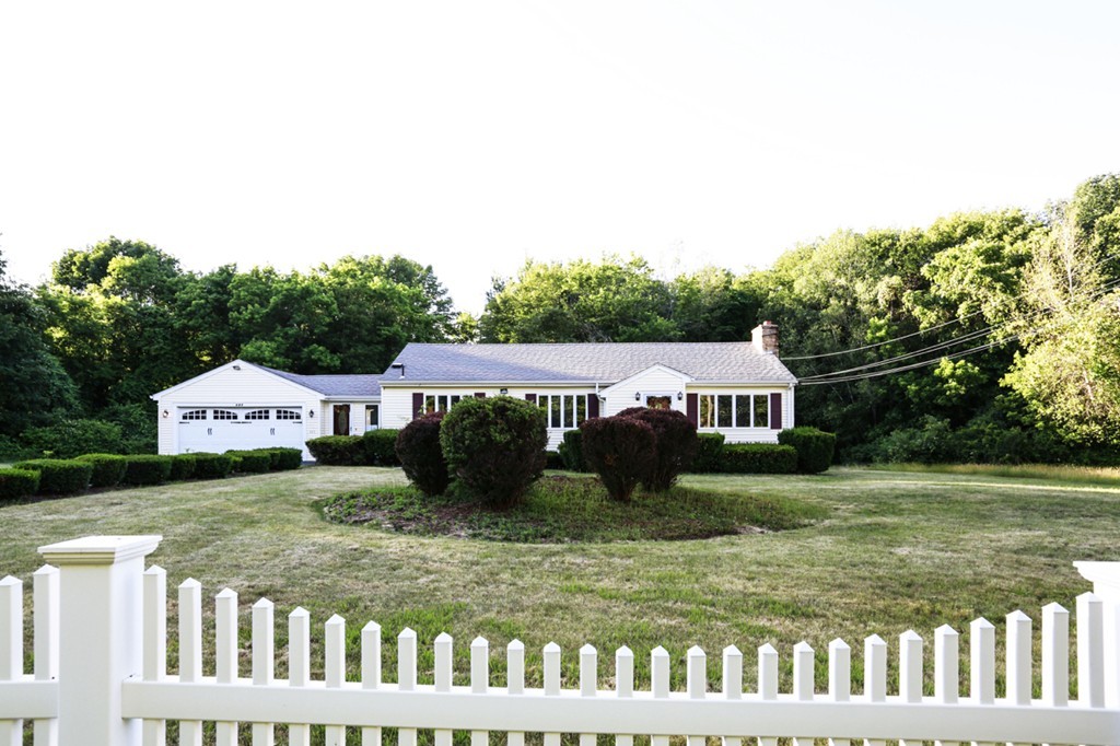 485 Rhodes Avenue Woonsocket, RI 02895 - Photo 3 of 18 a front view of a house with a yard