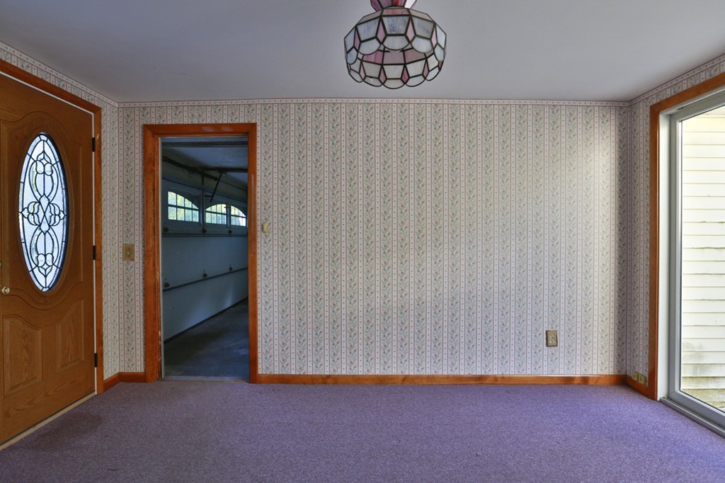 485 Rhodes Avenue Woonsocket, RI 02895 - Photo 4 of 18 a view of an empty room with a window