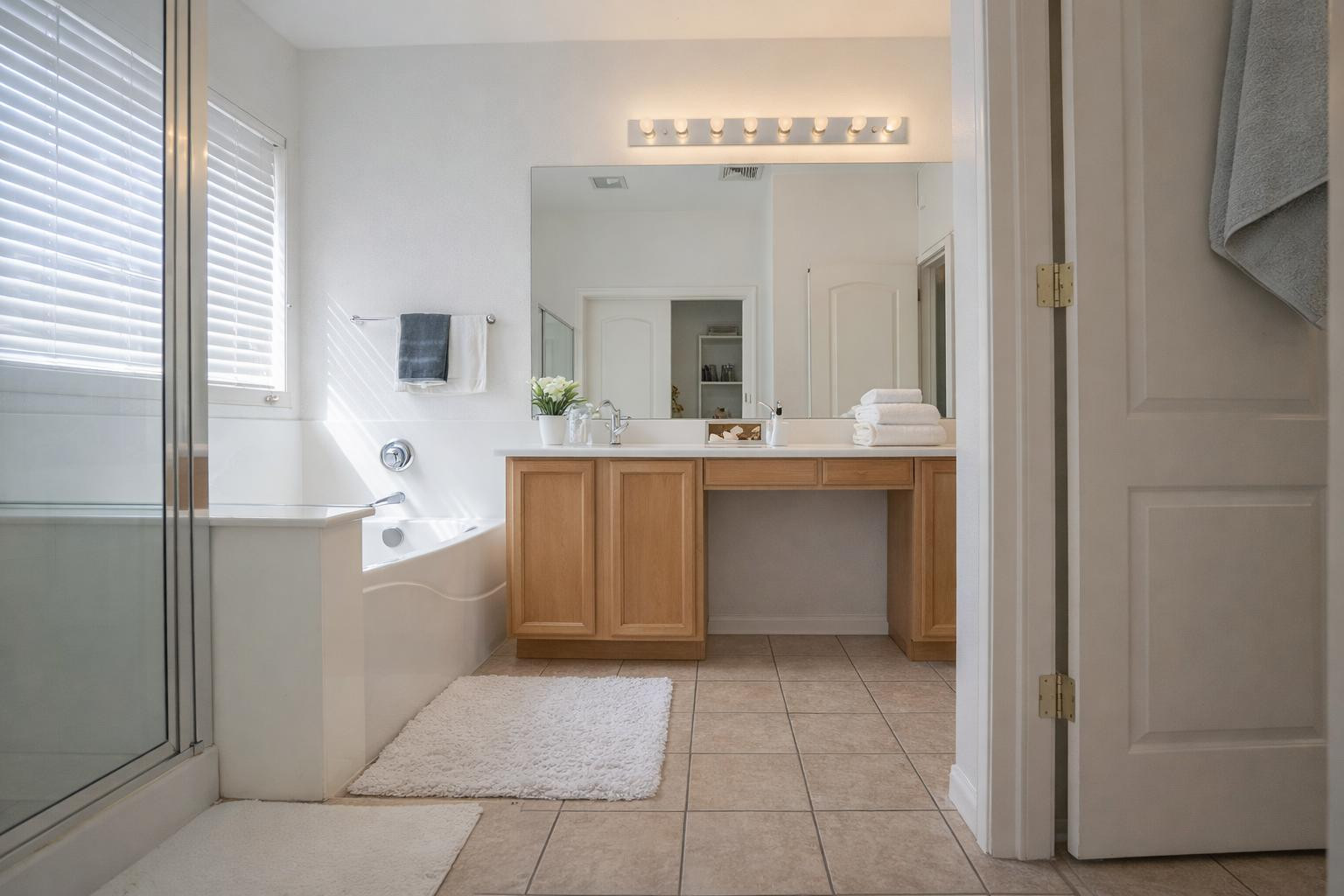 9377 West Milkweed Loop Phoenix, AZ 85037 - Photo 15 of 28 a large kitchen with a sink and cabinets