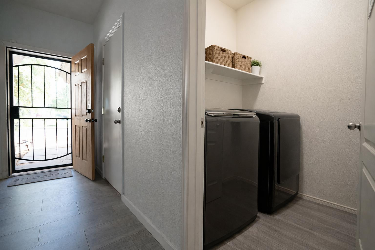 9377 West Milkweed Loop Phoenix, AZ 85037 - Photo 16 of 28 a view of a utility room with closet and windows