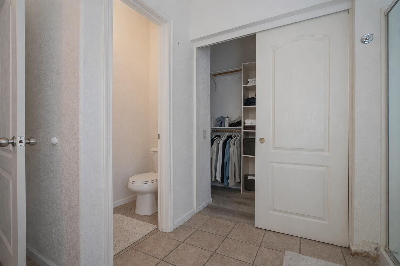 9377 West Milkweed Loop Phoenix, AZ 85037 - Photo 18 of 28 a bathroom with a toilet and a sink