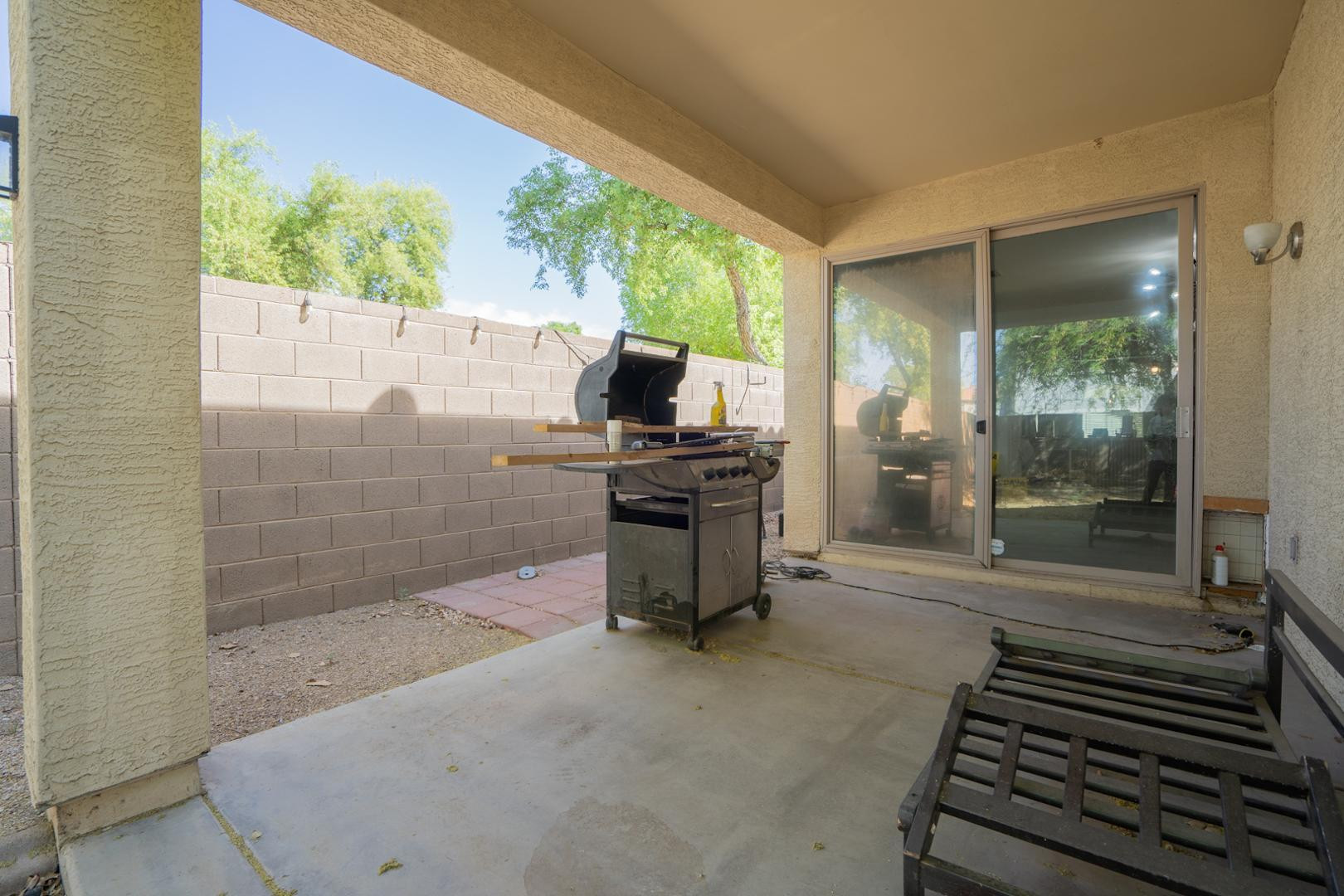 9377 West Milkweed Loop Phoenix, AZ 85037 - Photo 19 of 28 a bathroom with a bathtub and a shower