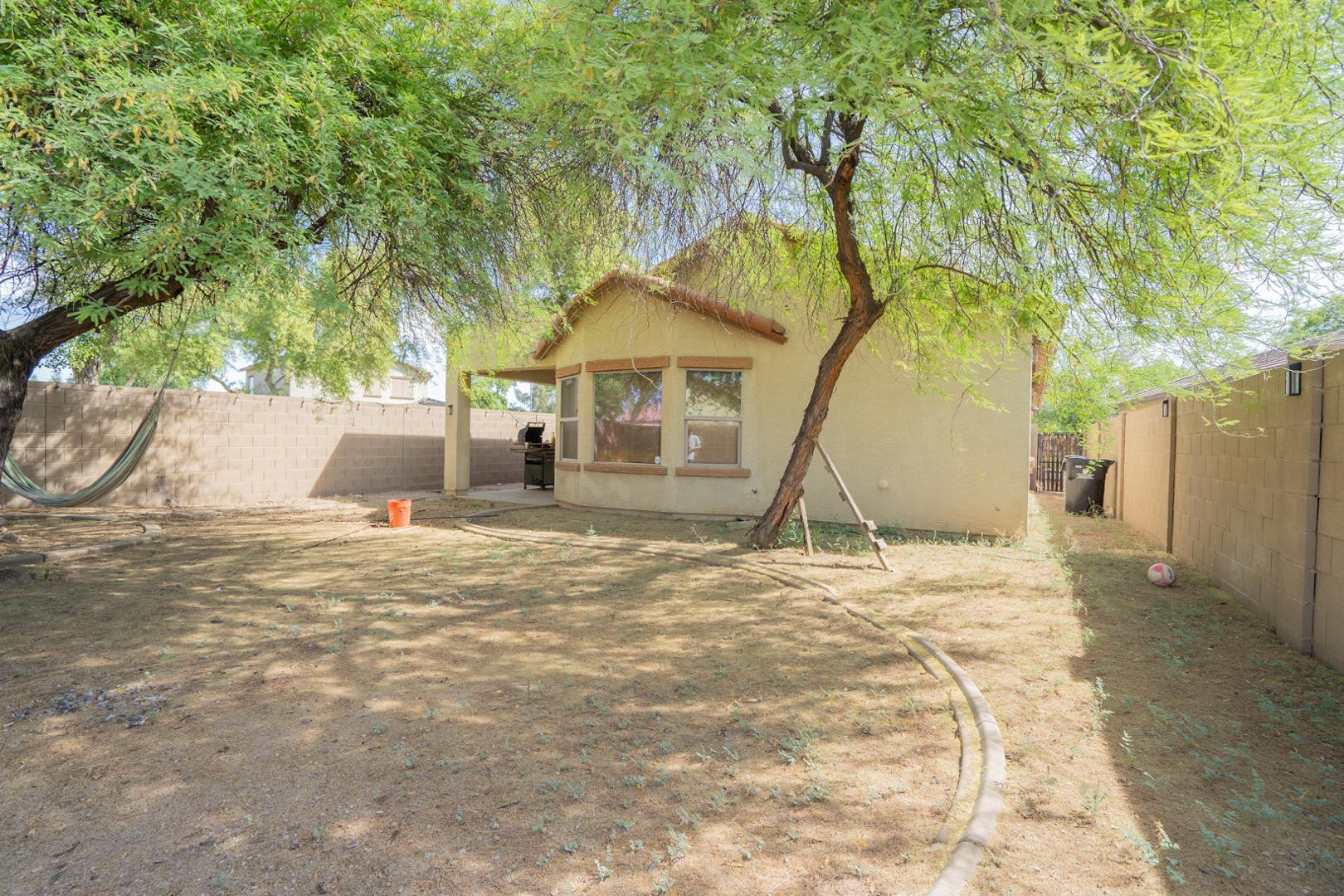 9377 West Milkweed Loop Phoenix, AZ 85037 - Photo 22 of 28 a view of outdoor space yard and basketball court