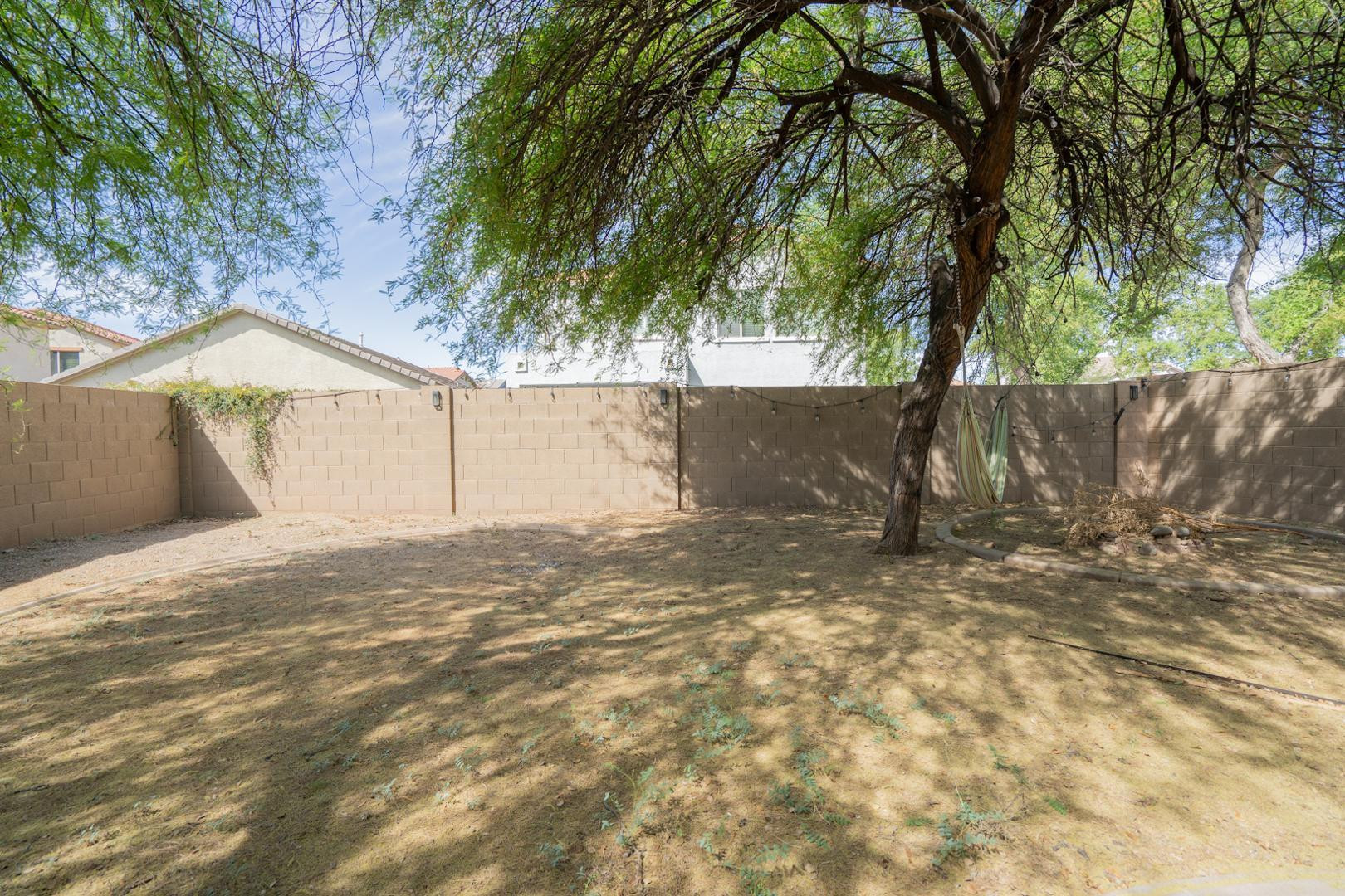 9377 West Milkweed Loop Phoenix, AZ 85037 - Photo 24 of 28 a view of backyard of a house