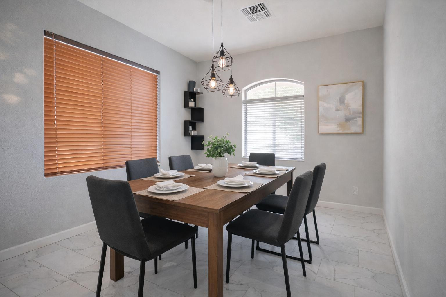 9377 West Milkweed Loop Phoenix, AZ 85037 - Photo 7 of 28 a view of a dining room with furniture window and wooden floor
