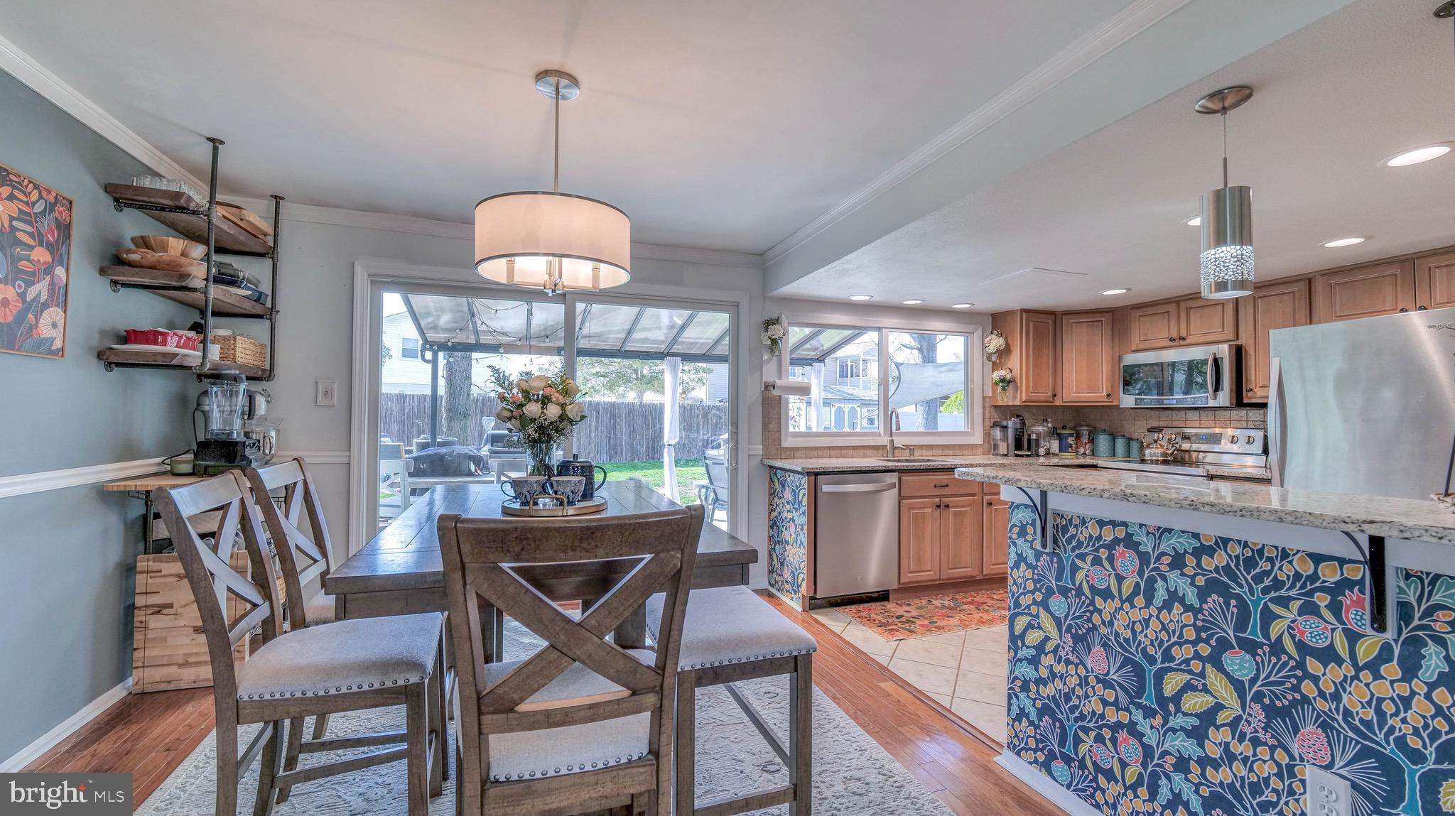 1 Chadwick Avenue Marlton, NJ 08053 - Photo 11 of 41 a kitchen with refrigerator dining table and chairs