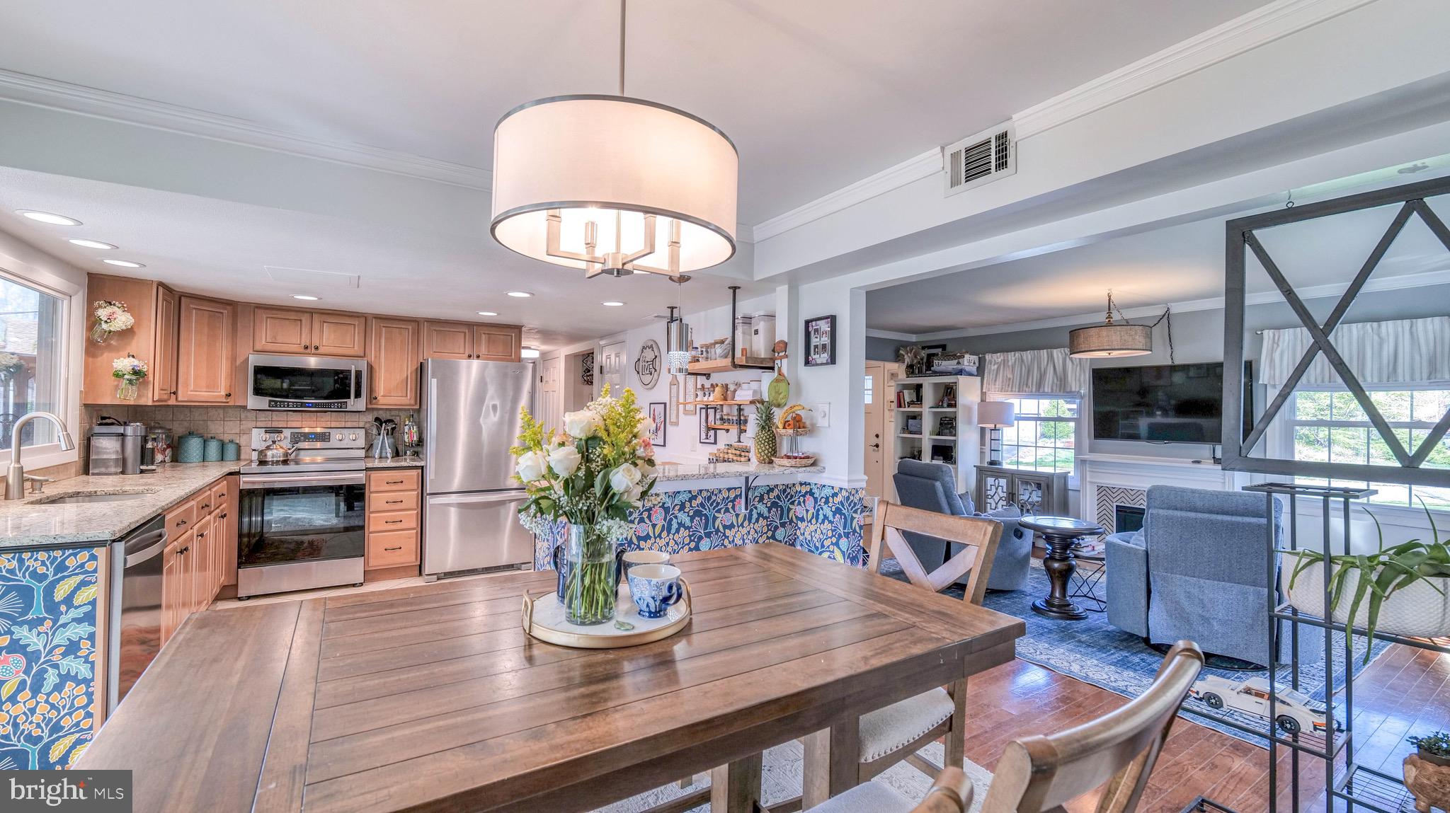 1 Chadwick Avenue Marlton, NJ 08053 - Photo 12 of 41 a kitchen with a table chairs refrigerator and microwave