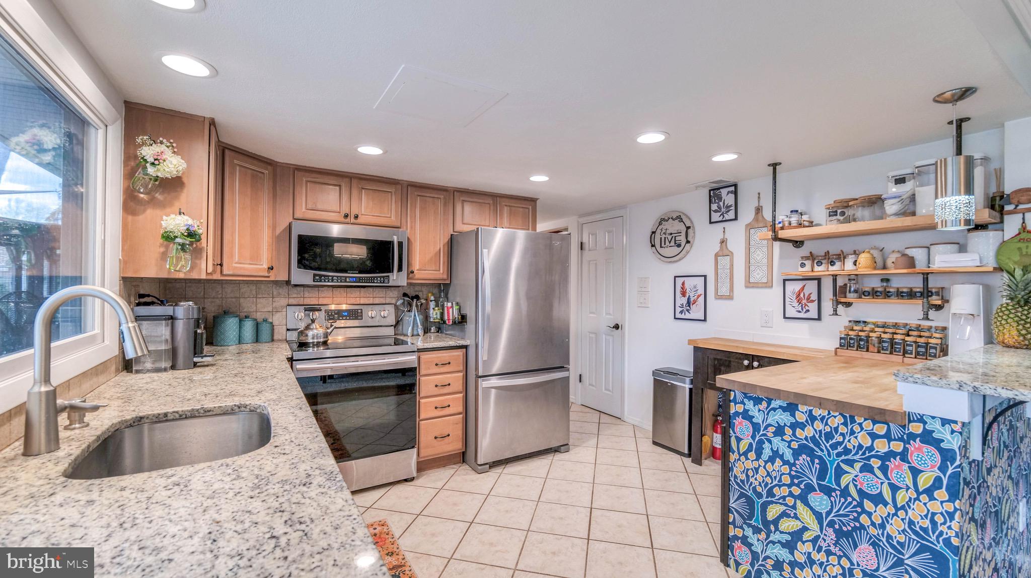 1 Chadwick Avenue Marlton, NJ 08053 - Photo 15 of 41 a kitchen with stainless steel appliances granite countertop a sink stove and refrigerator