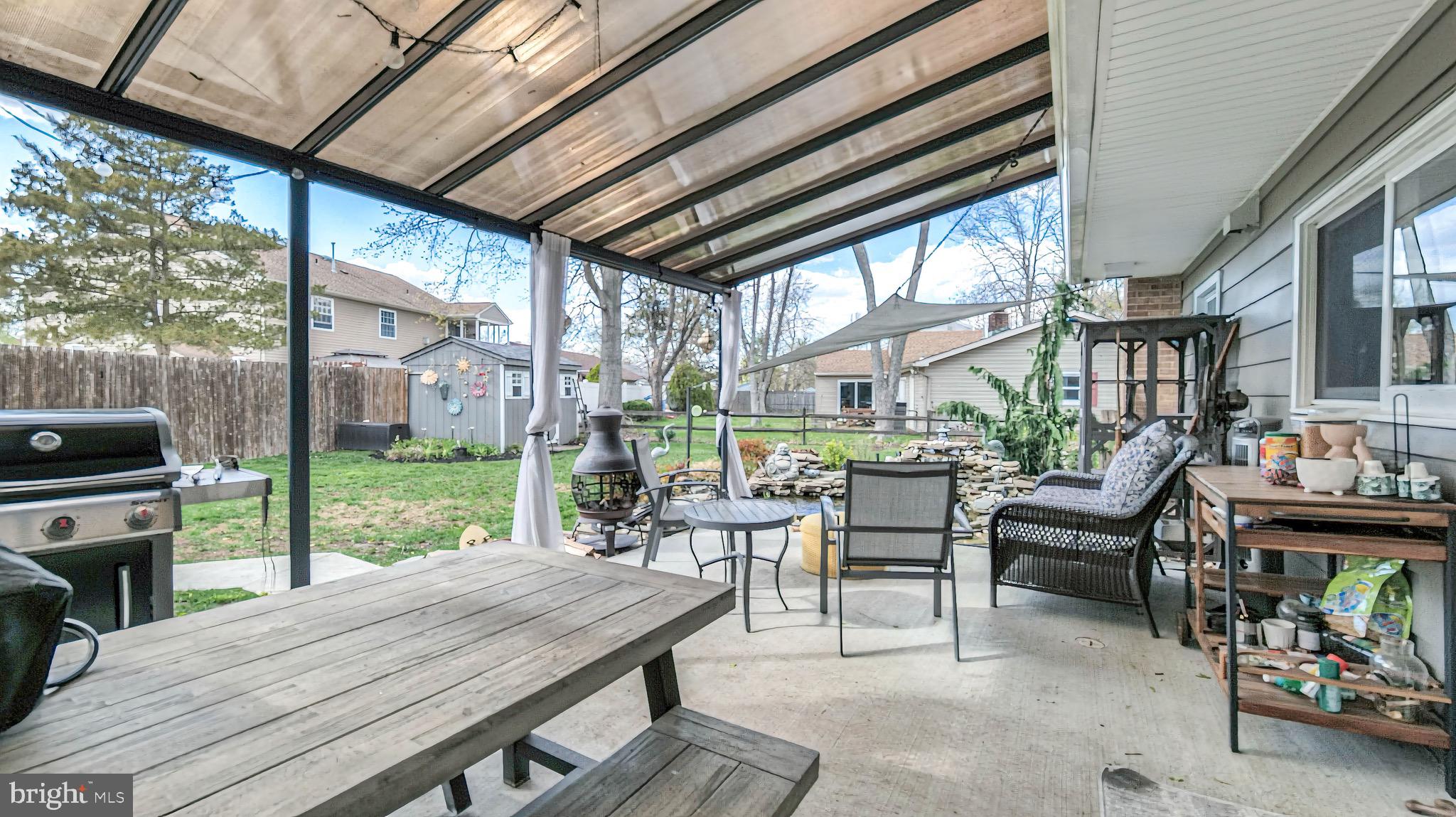 1 Chadwick Avenue Marlton, NJ 08053 - Photo 33 of 41 a view of a patio with a table chairs and a backyard