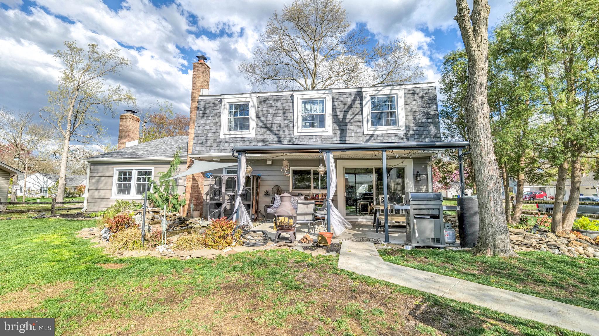 1 Chadwick Avenue Marlton, NJ 08053 - Photo 38 of 41 a front view of a house with a yard table and chairs