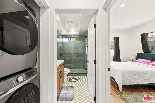 a en suite bathroom with a sink a toilet and shower