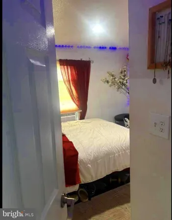 a room with a bed and a window