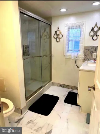 a bathroom with a sink and a shower