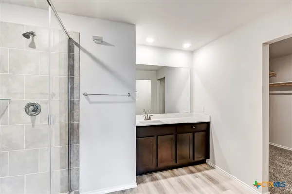 a bathroom with a sink and mirror
