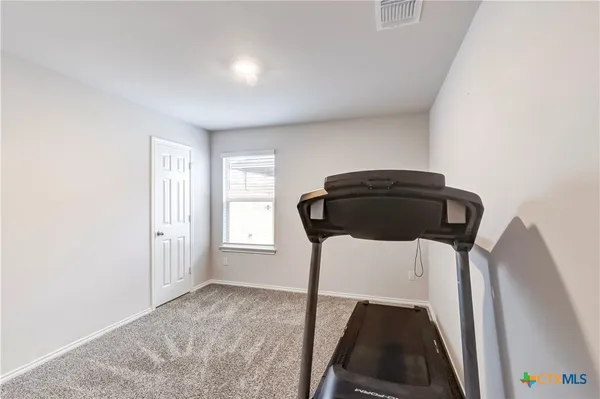 a view of chair and wooden floor in a room