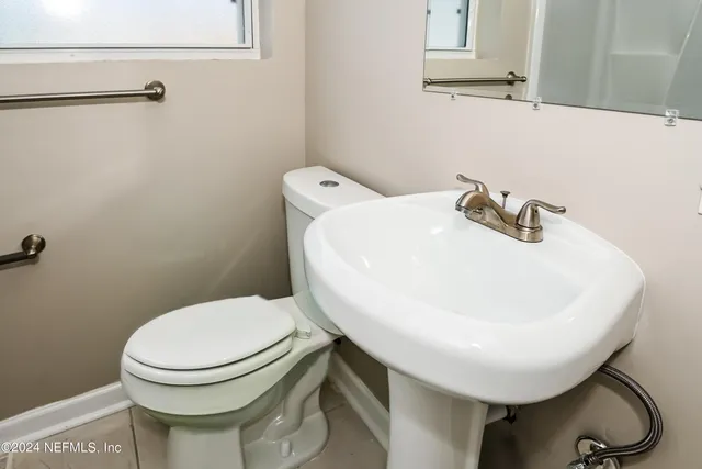 a bathroom with a toilet and a sink