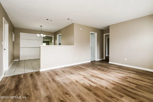 a view of a livingroom with wooden floor