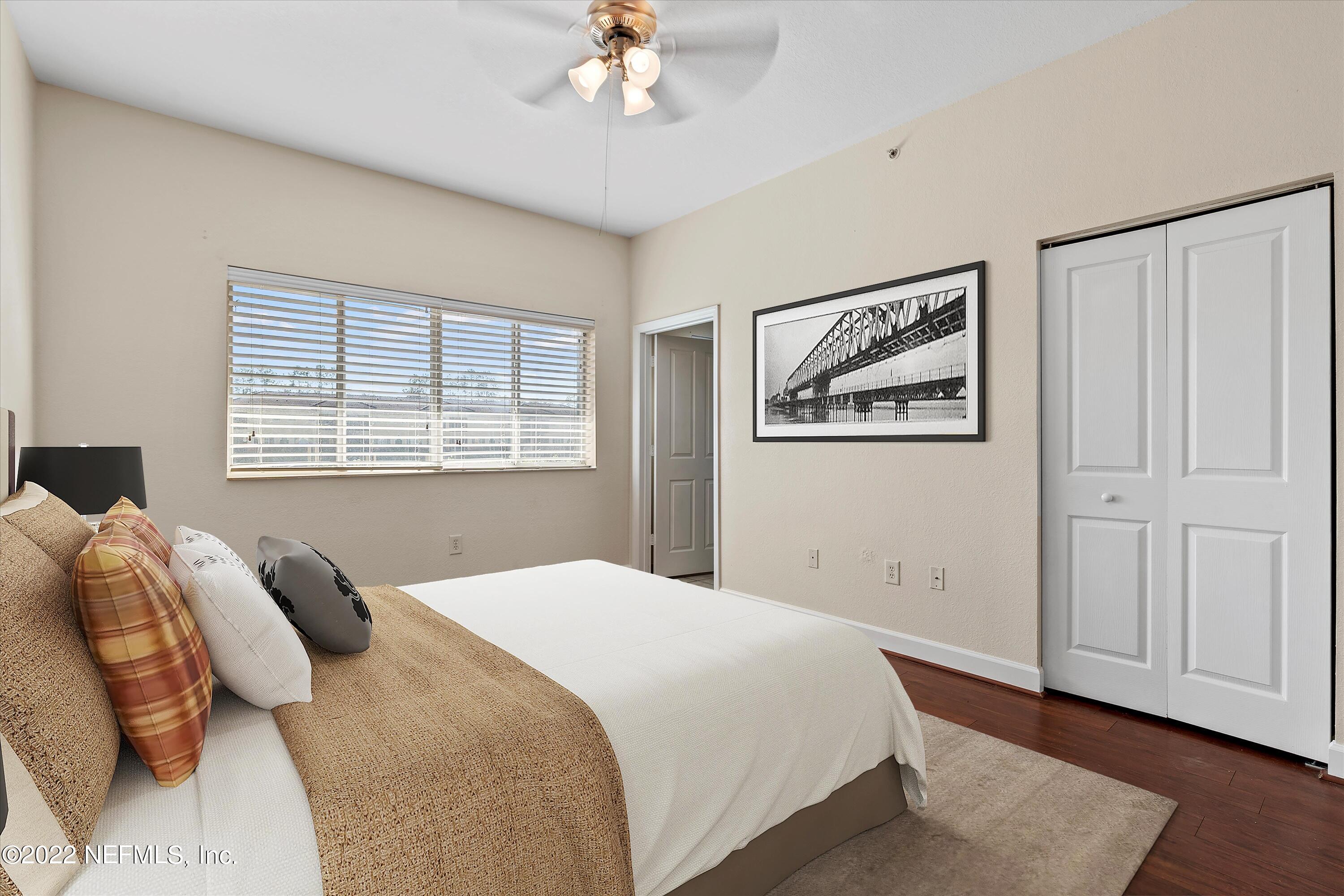 9745 Touchton Road, Unit 3203 Jacksonville, FL 32246 - Photo 12 of 30 a bedroom with a large bed and a window