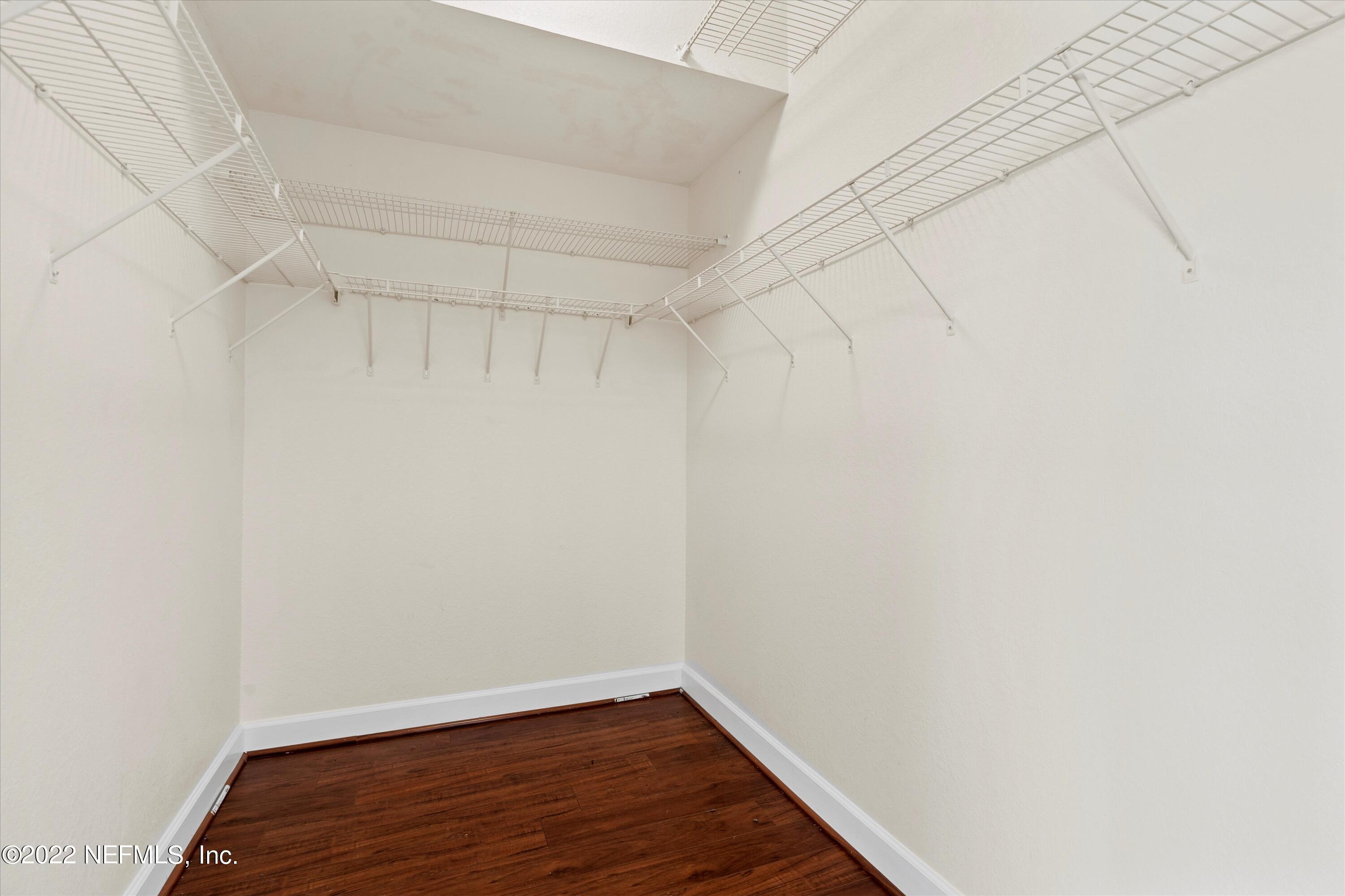 9745 Touchton Road, Unit 3203 Jacksonville, FL 32246 - Photo 13 of 30 a view of a room with wooden floor