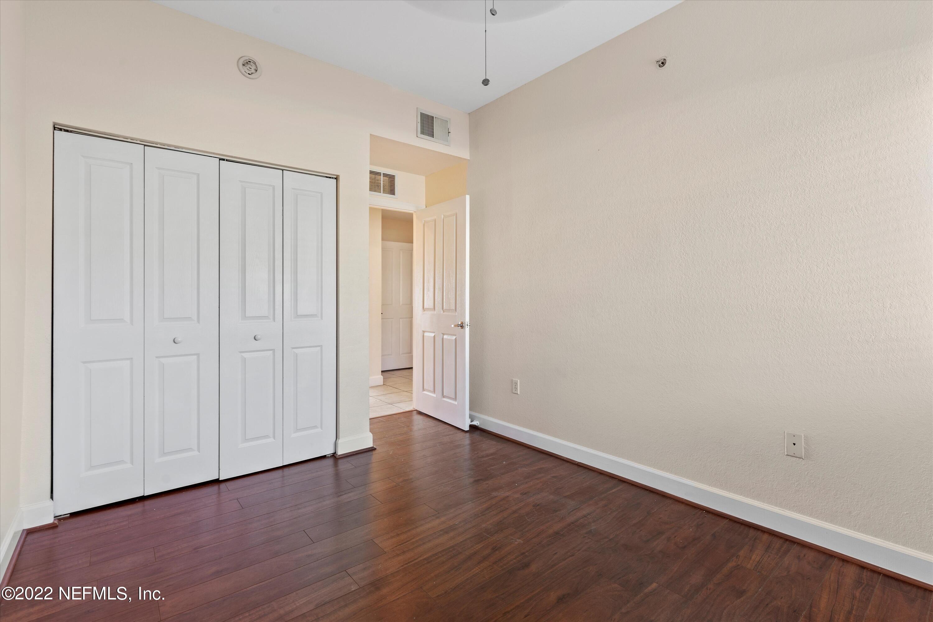 9745 Touchton Road, Unit 3203 Jacksonville, FL 32246 - Photo 17 of 30 a view of an empty room with wooden floor