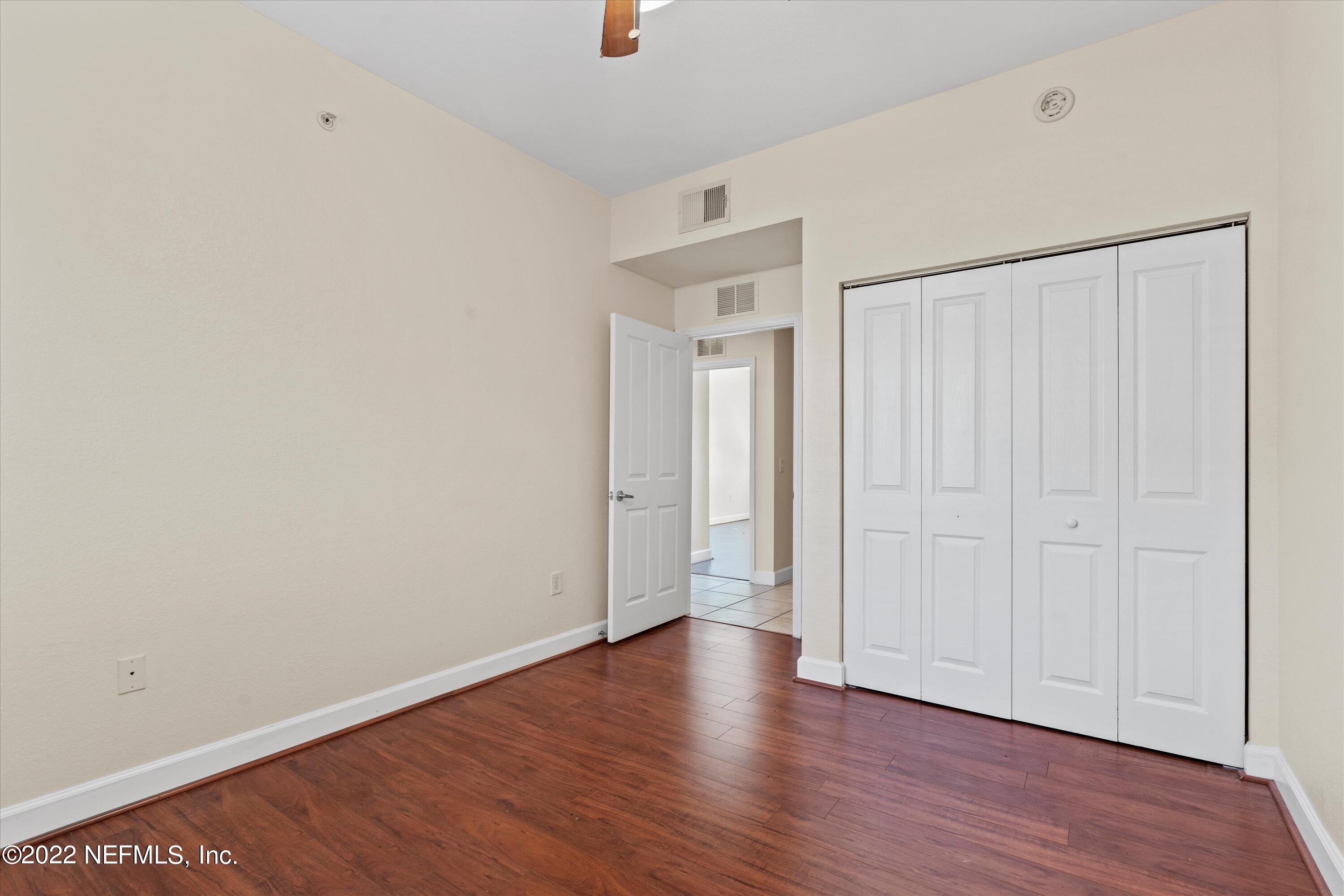 9745 Touchton Road, Unit 3203 Jacksonville, FL 32246 - Photo 18 of 30 a view of an empty room with wooden floor