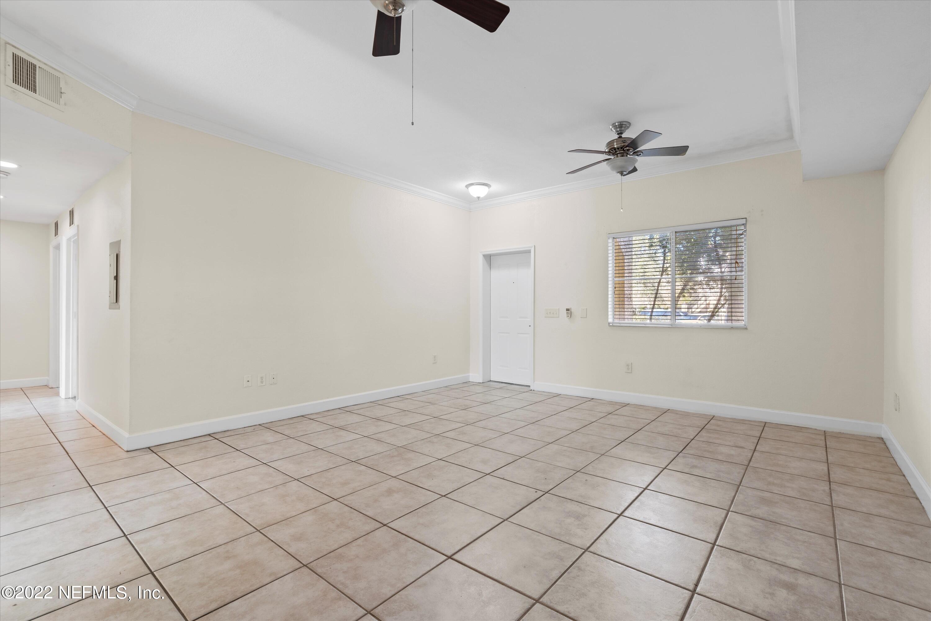 9745 Touchton Road, Unit 3203 Jacksonville, FL 32246 - Photo 3 of 30 a view of an empty room and window