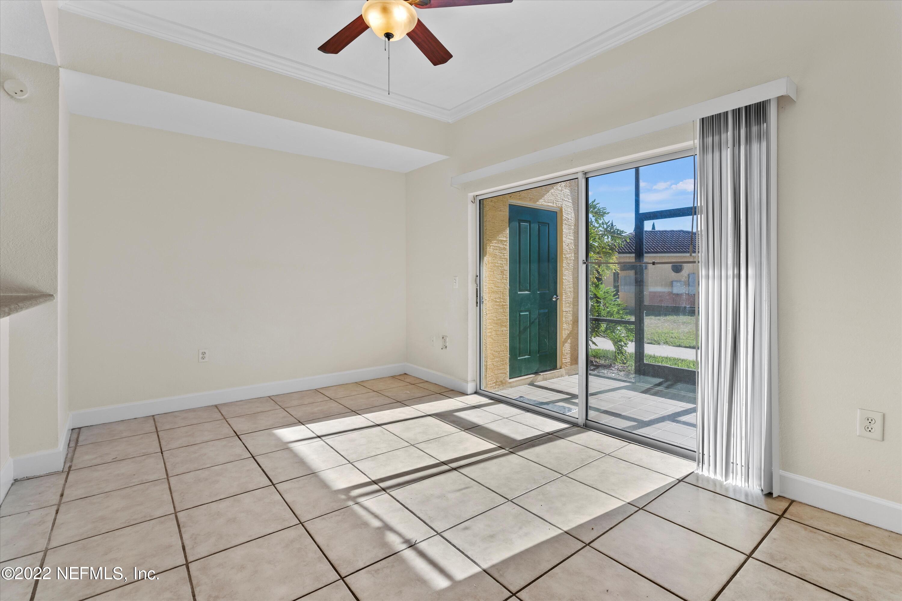 9745 Touchton Road, Unit 3203 Jacksonville, FL 32246 - Photo 8 of 30 a view of an empty room and window