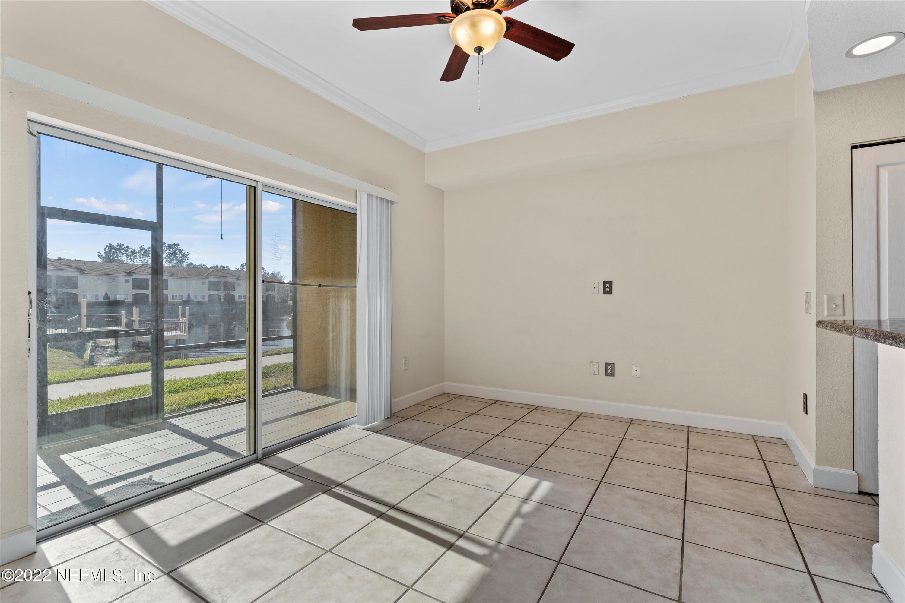 9745 Touchton Road, Unit 3203 Jacksonville, FL 32246 - Photo 10 of 30 a view of an empty room and window ceiling fan
