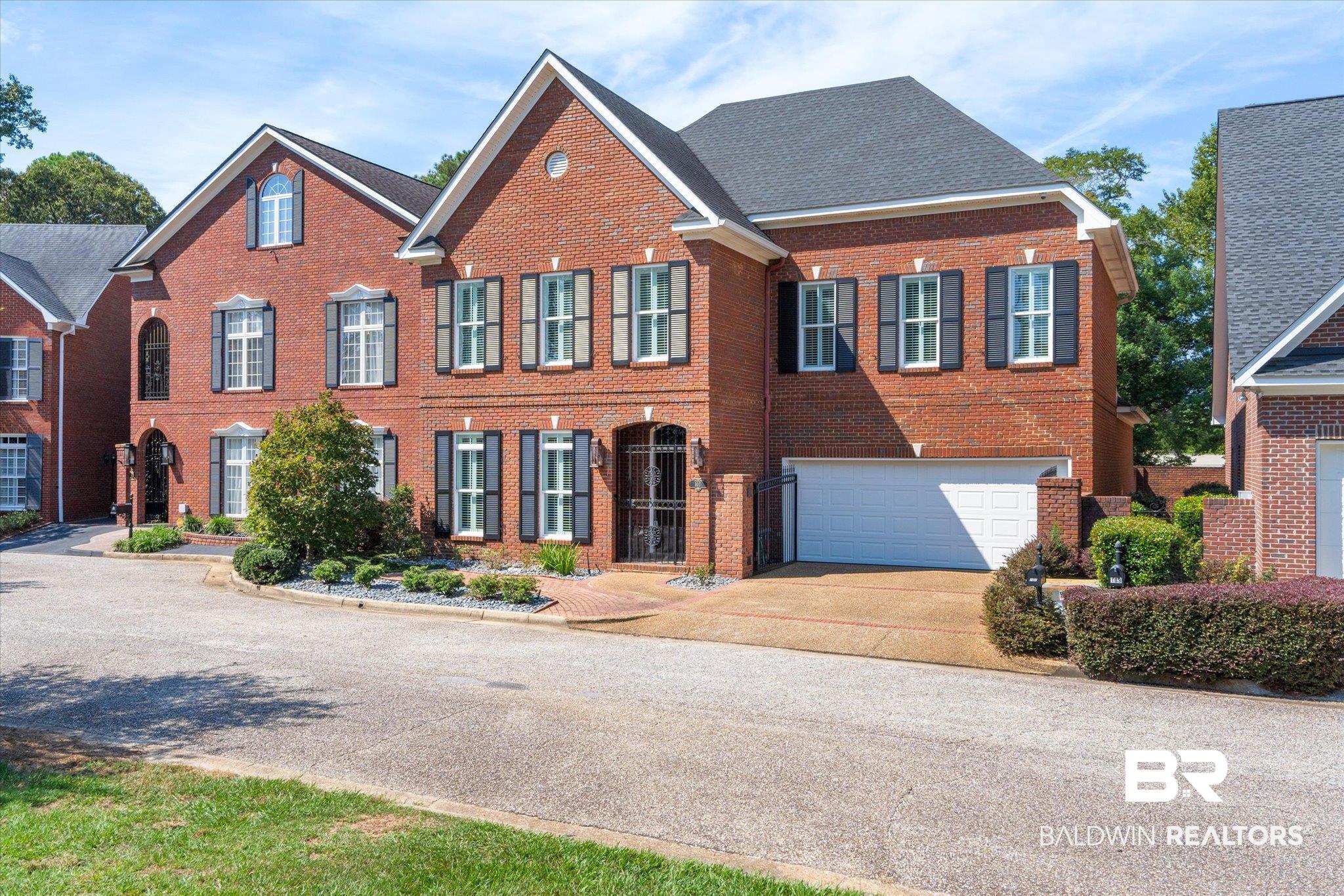 107 Fielding Place Mobile, AL 36608 - Photo 1 of 27 View of front of house with brick siding, concrete driveway, and an attached garage