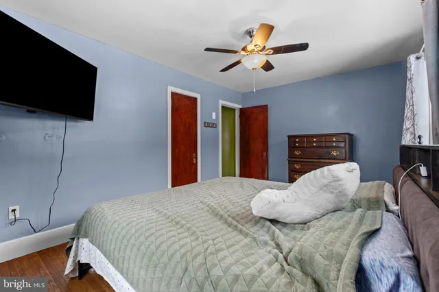 a bathroom with a granite countertop double vanity sink and a mirror