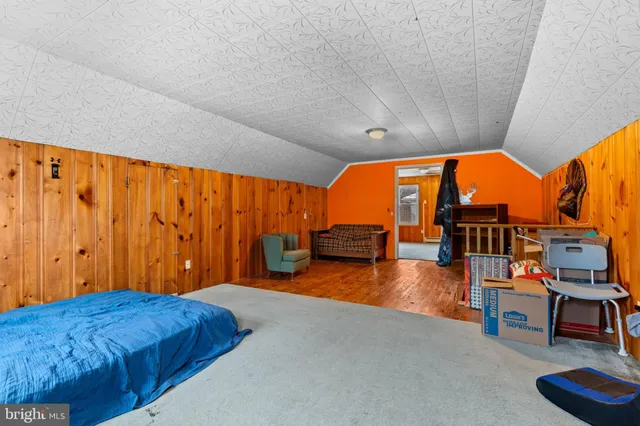 a view of a room with wooden walls