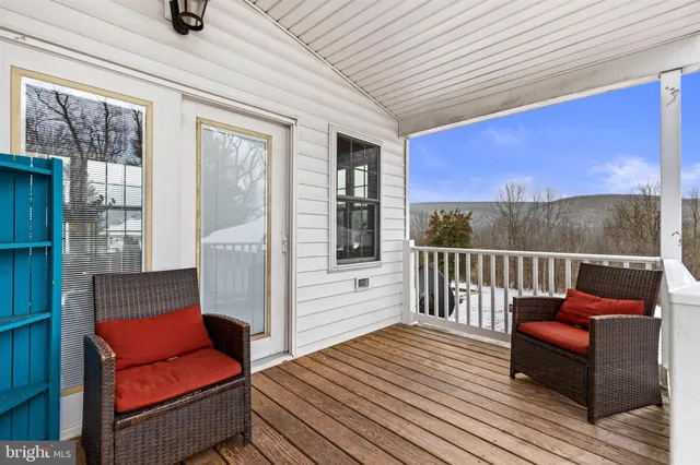 a view of a dry yard with car parked