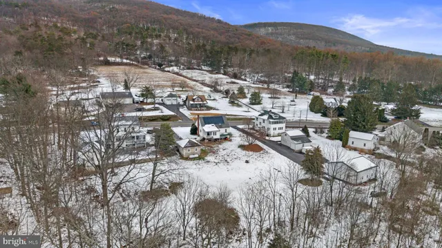 an aerial view of residential house with wooden stairs
