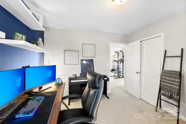 a view of room with window and refrigerator