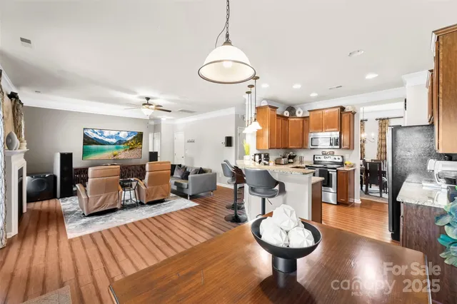 a living room with fireplace furniture and a wooden floor