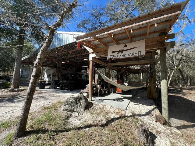 a view of a house with snow on the road