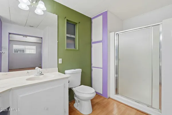 a bathroom with a sink vanity and a mirror