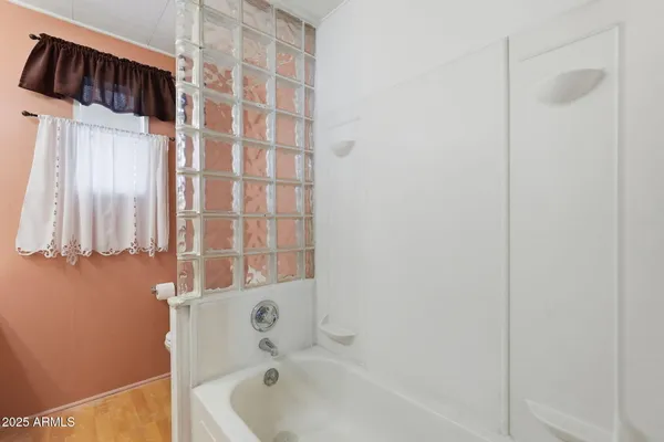 a bathroom with a sink vanity and a mirror