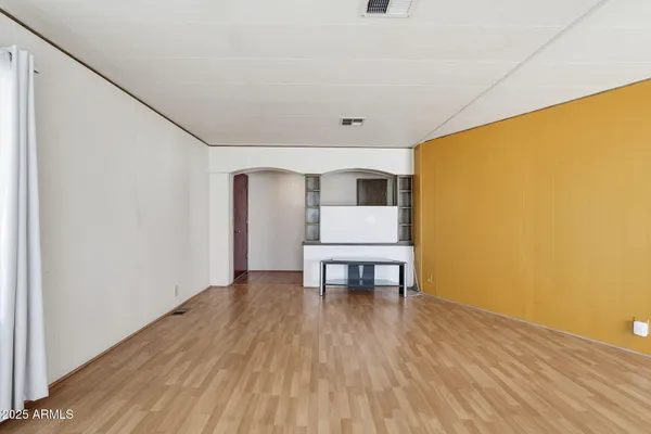 a view of room with furniture and wooden floor