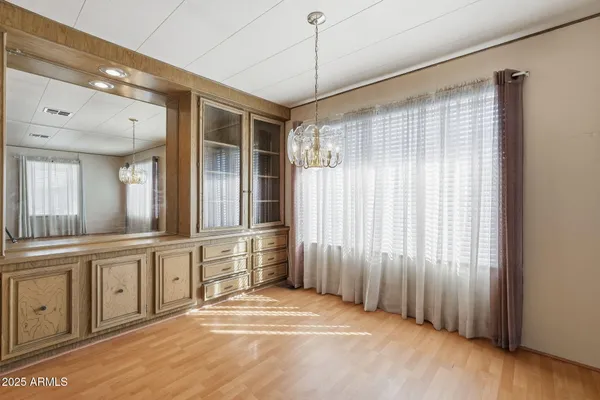 a view of a livingroom with furniture and wooden floor