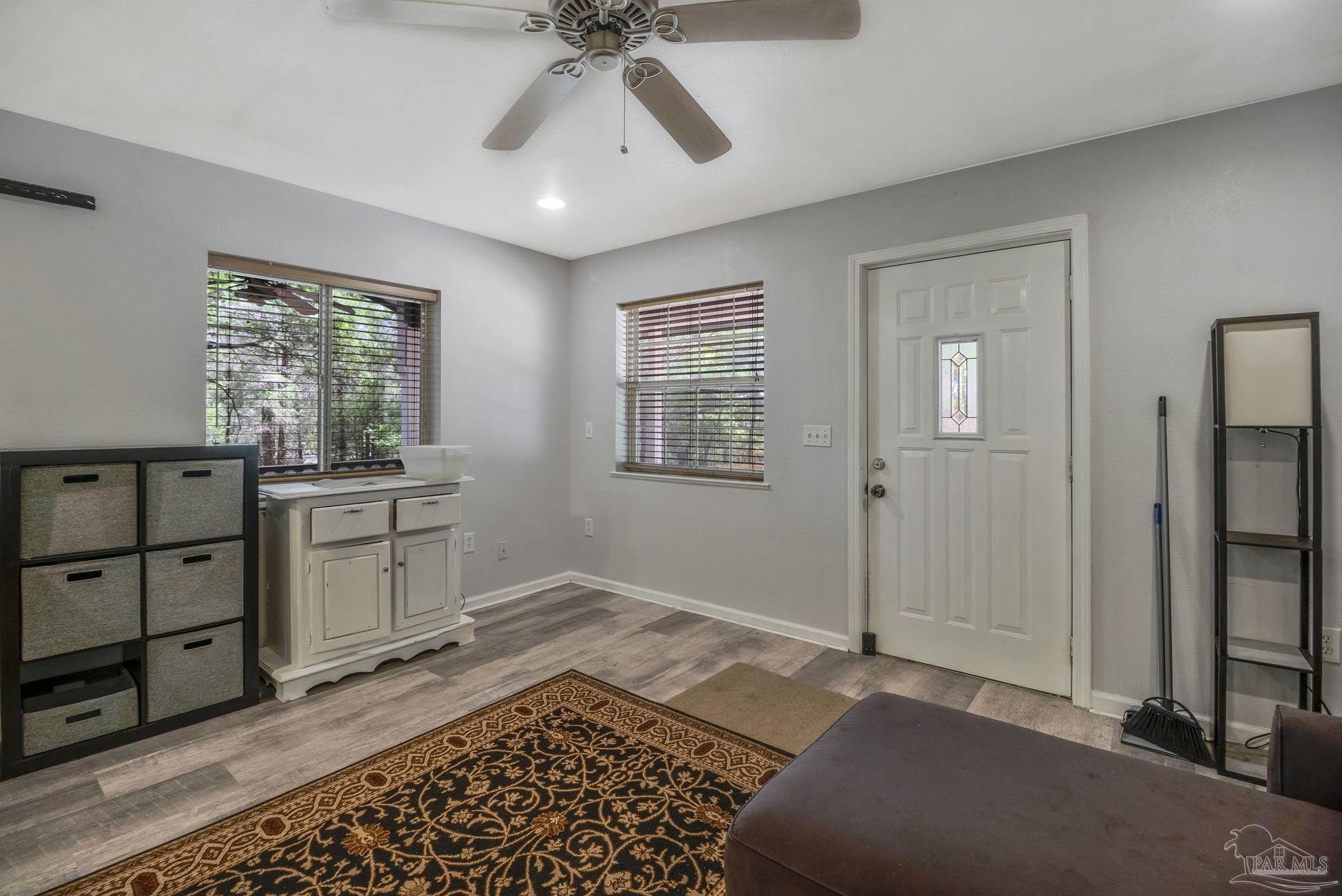 10290 West Lake Road Milton, FL 32583 - Photo 9 of 53 a view of a livingroom with furniture and window